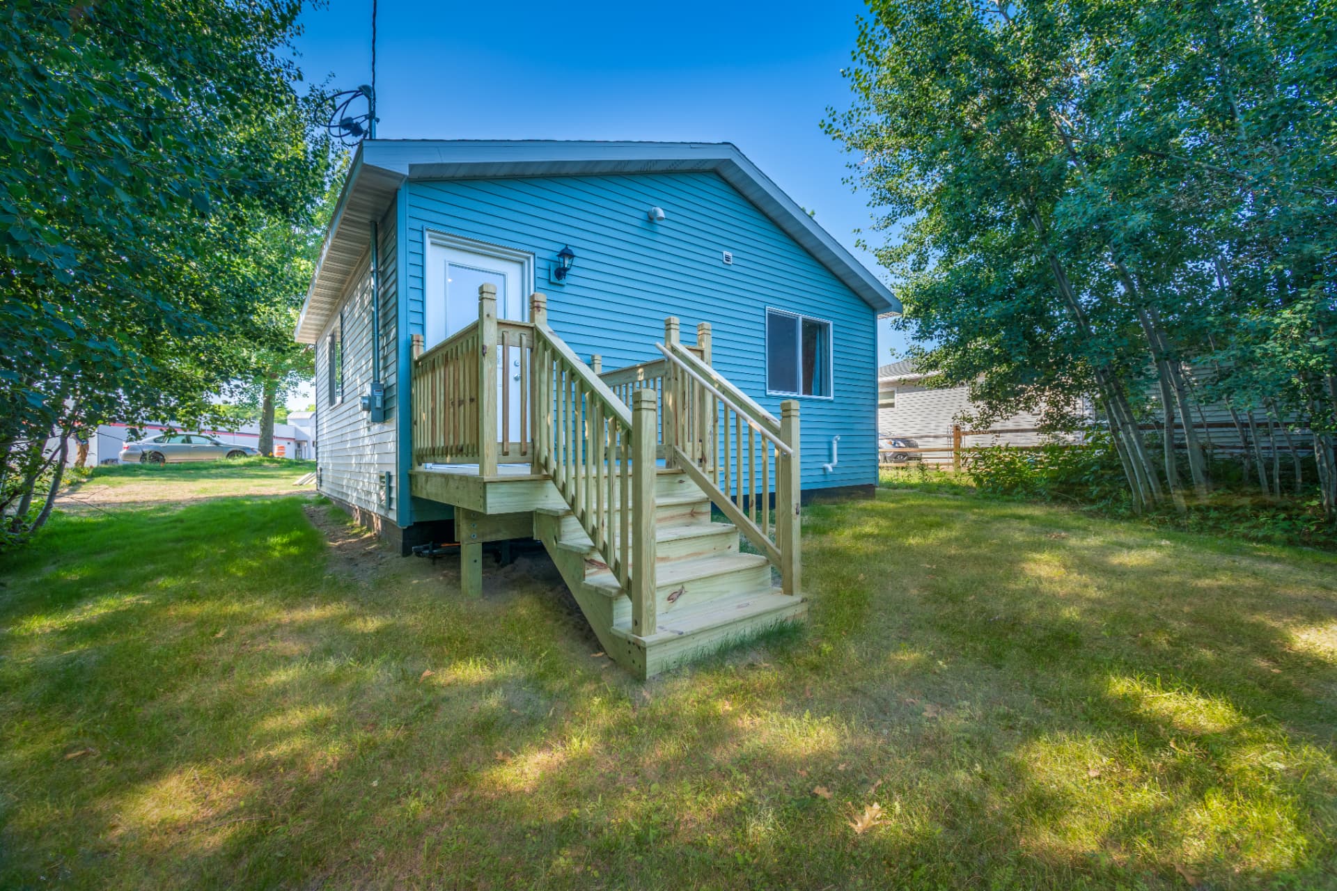 Rear elevation with new railing and stair system on a Marquette new build