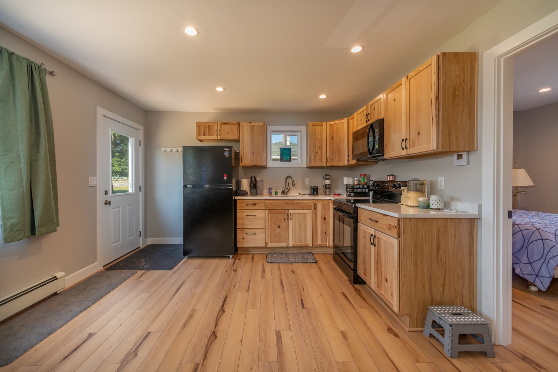 Kitchen and entry view of finished interior in Marquette County new build
