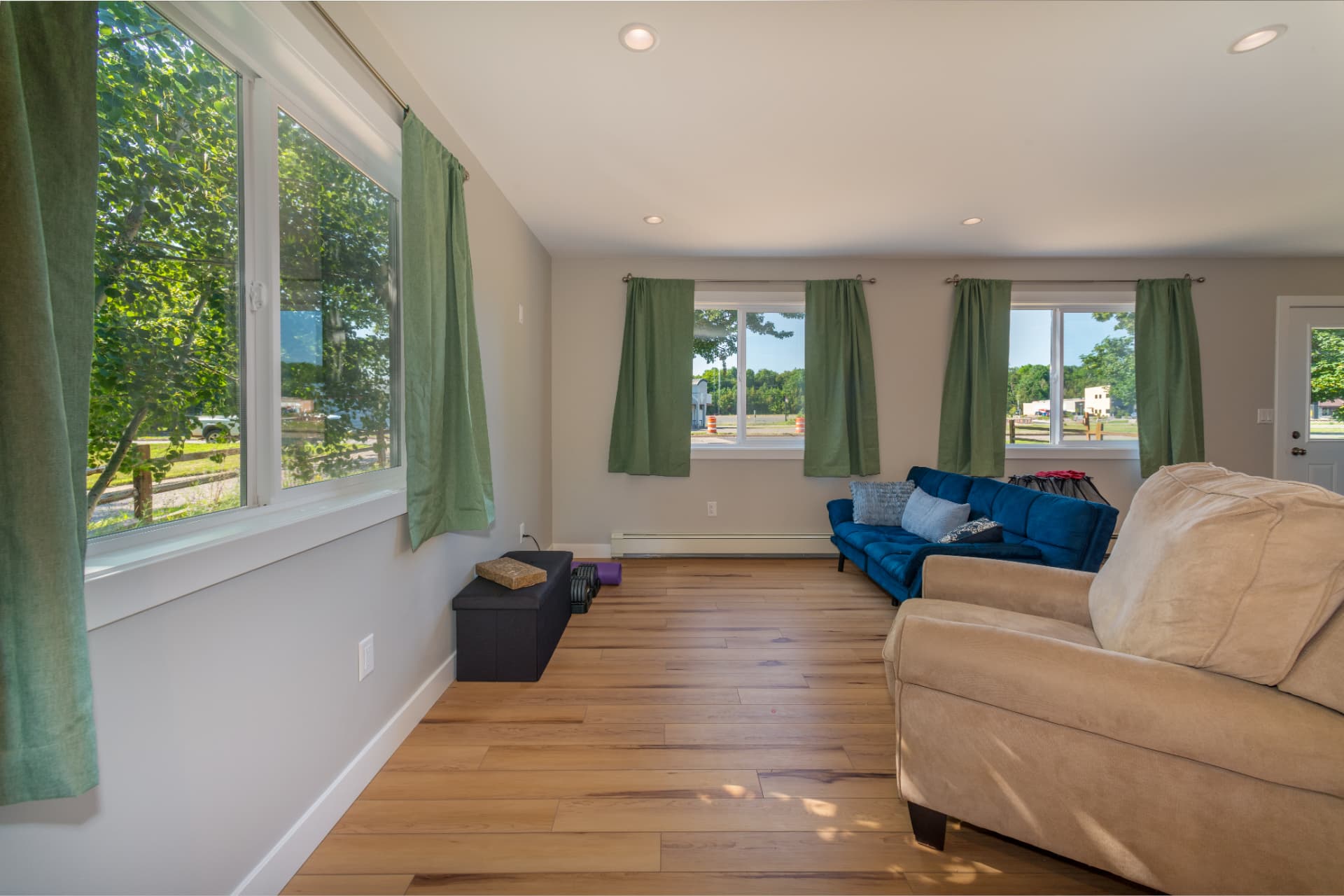 Bright living space with large windows in a Marquette new construction home