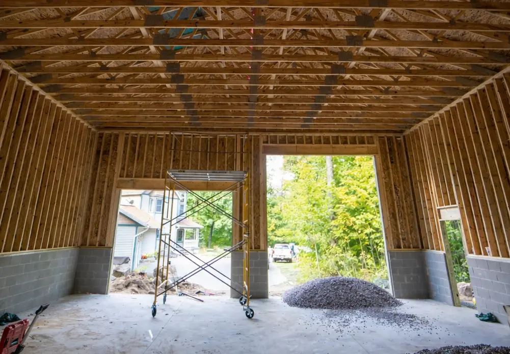 Garage framing construction with engineered roof trusses and block foundation in Marquette MI